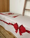 Скатертина новорічна з червоним бантом (140*180 см)